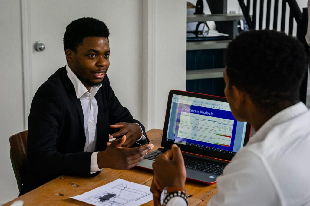 A professional presenting a product or service to a customer during an in-person discussion.